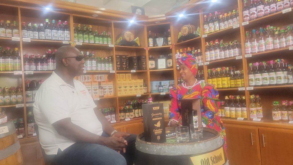 The owners of the Guavaberry distillery in conversation inside their shop